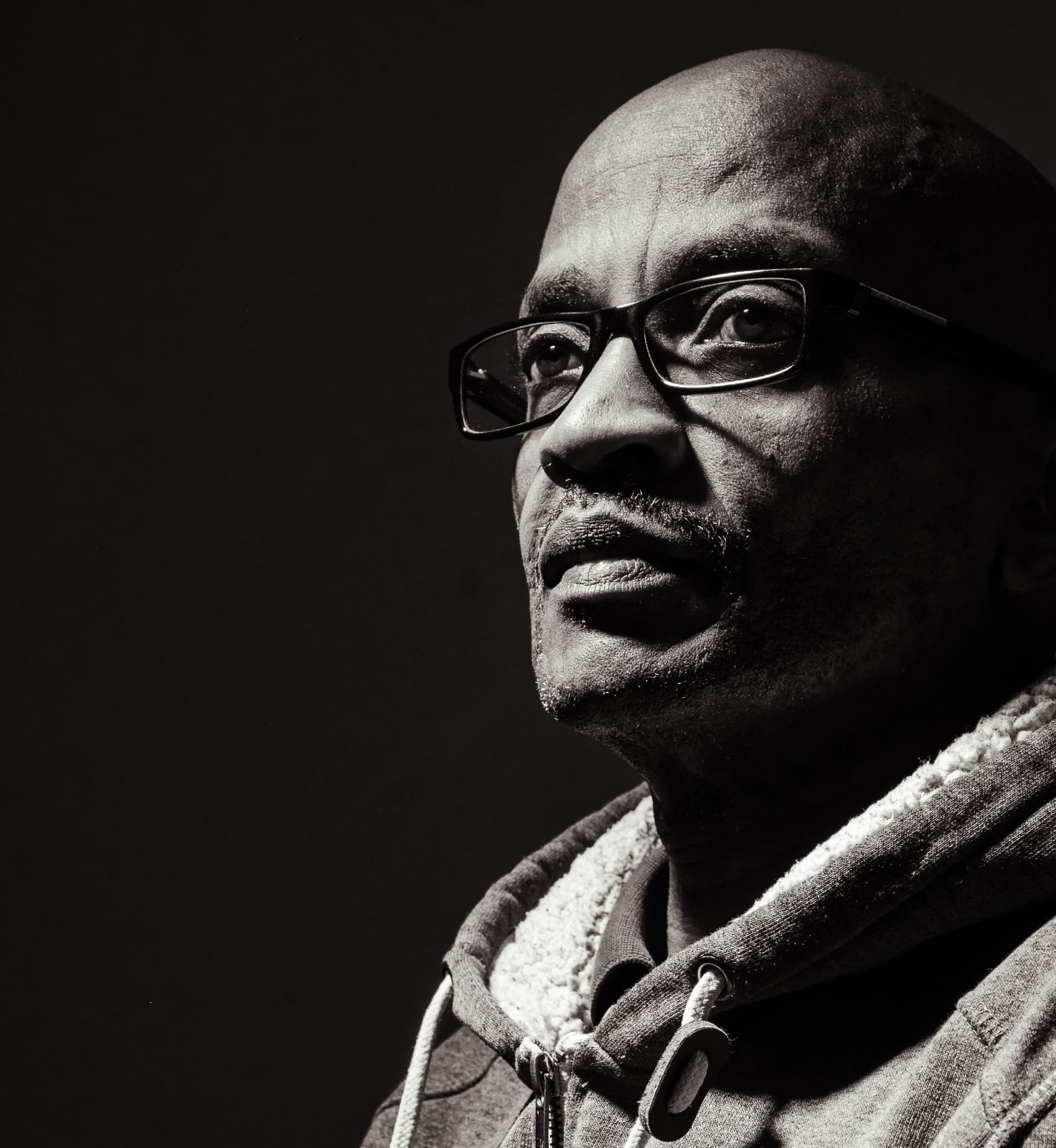 Portrait of commercial and editorial photographer Lenny Rukundo, photographed in black and white