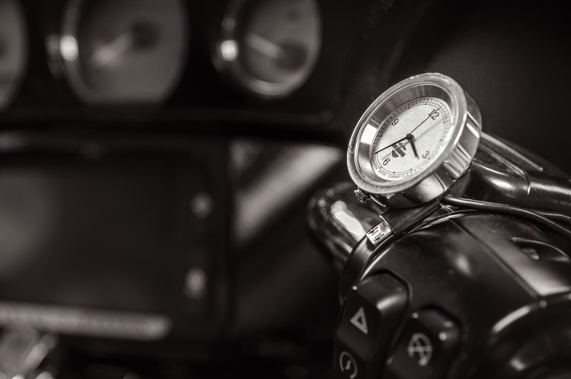Commercial photography — Perfect Timing personal project, wristwatch on motorcycle handlebar in monochrome